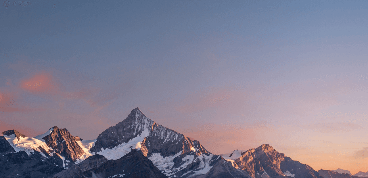 A landscape of mountains covered with snow