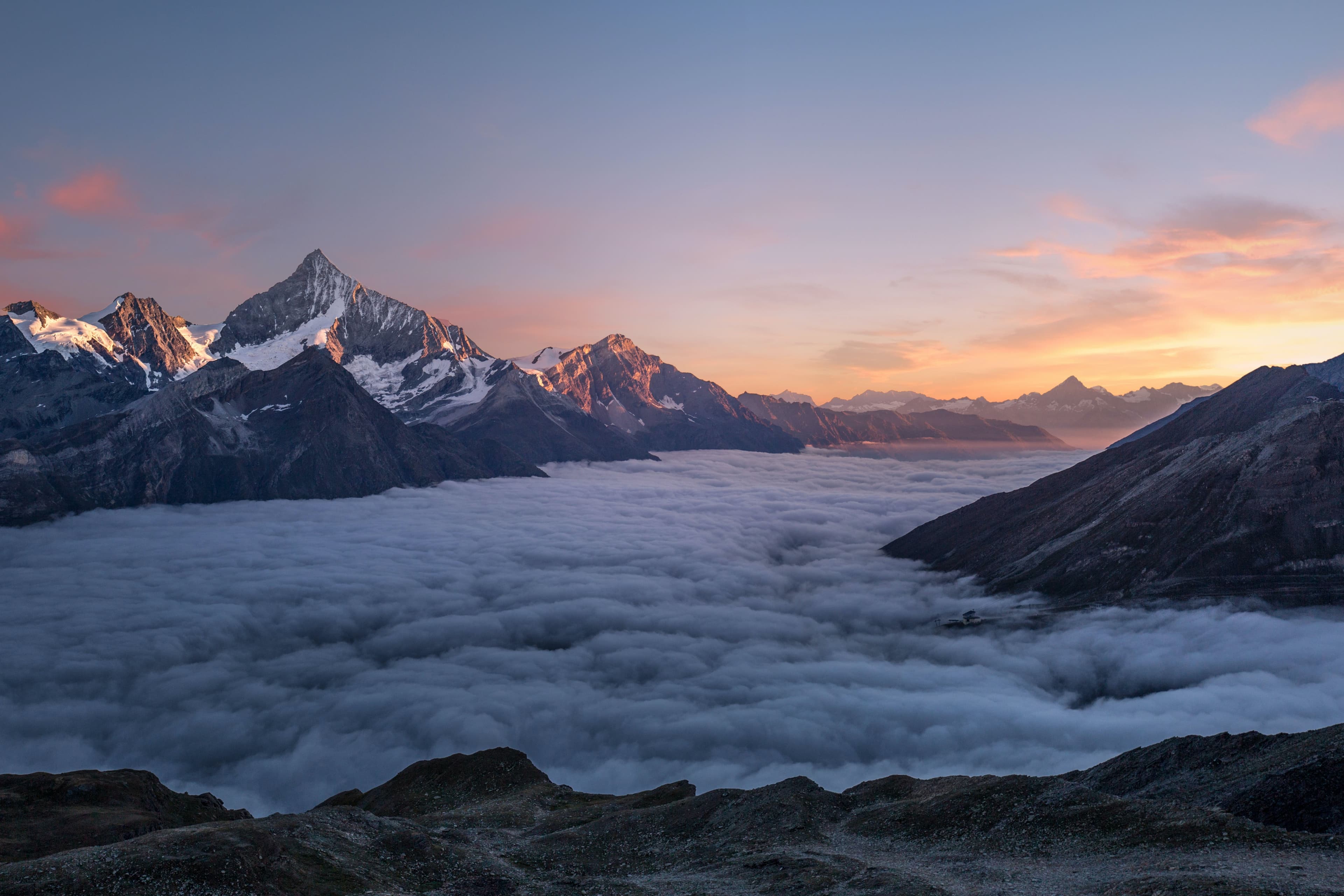 A landscape of mountains covered with snow