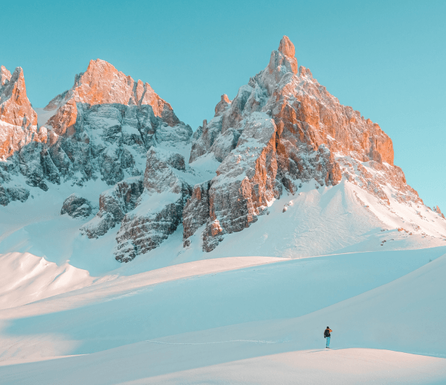 A landscape of mountains covered with snow