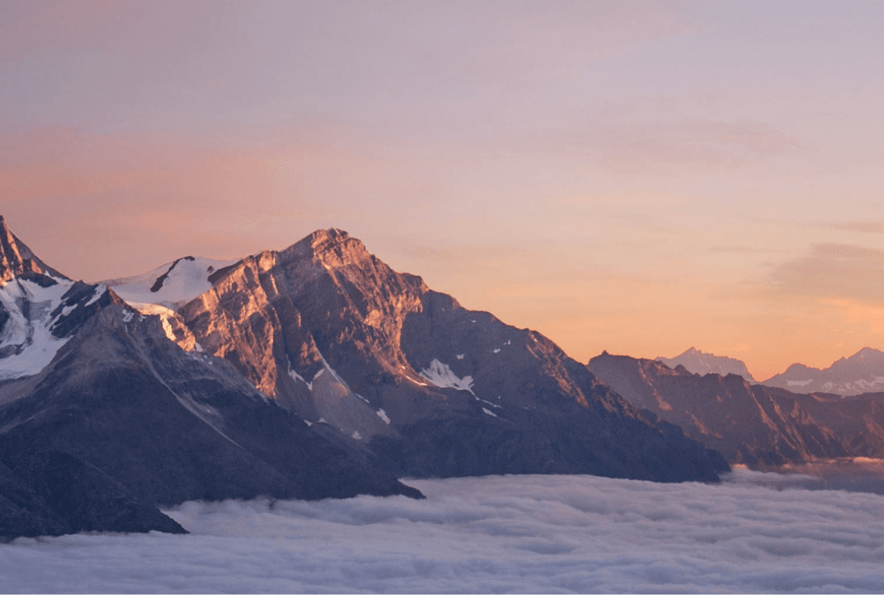 A landscape of mountains covered with snow